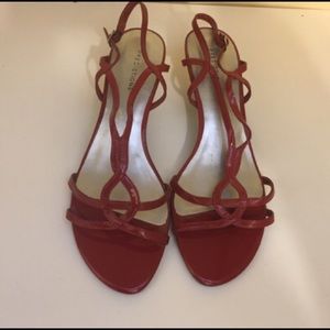 Red, patent leather, strappy heels by Predictions.